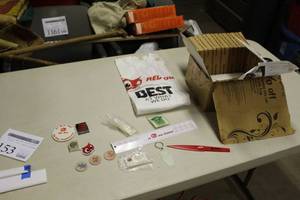 lot 153 image: Red Owl Collectibles    with T-shirt, Pins, Ruler, Letter Opener, Key Chain