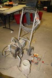 lot 51 image: Graco Titan 660 HPX Airless Paint Sprayer    with Accessories - RAC 5 Switch Tip, RAC5 Hand Tite Guard, Backing Saver Lubricant, Spray Wand, Spray Tips, Misc. Accessories