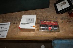 lot 234 image: Lot of (2) Household    with Atlas Keyed Entry Door Knob, Honeywell Non-Programmable Thermostat