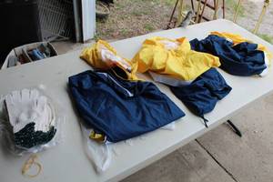 lot 322 image: Lot of (9) Clothing   (new)  with Wind Breaker Hooded Sweatshirts (x3), Work Gloves (6 pair)