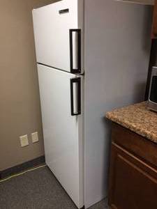lot 44 image: White Westinghouse Frost Free RefrigeratorFreezer - Great Working Condition - Finish inside Door Came Off So Rust is present - Good For Garage, Cabin Or Smoke Shack