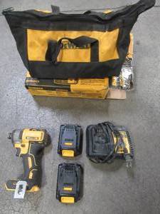 lot 18 image: DEWALT ATOMIC 20-Volt MAX Cordless Brushless Compact 14 in. Impact Driver, (2) 20-Volt 1.3Ah Batteries, Charger & Bag, DCF809C2, Used.