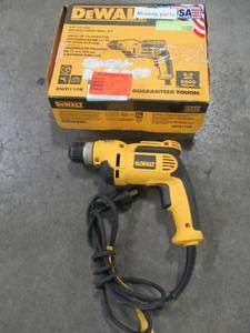 lot 23 image: DEWALT 38 in. Pistol Grip Drill Kit, DWD110K - Used.