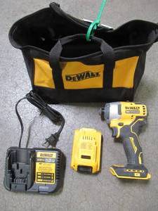 lot 74 image: DEWALT ATOMIC 20-Volt MAX Brushless Cordless Compact Impact Driver With (1) 2ah Battery and Charger, DCF809B - Used.