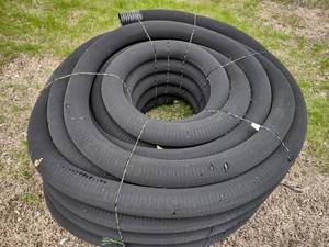 lot 34 image: 4 x 250 Perforated Drain Pipe Rol...