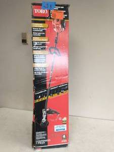 lot 34 image: TORO 2-Cycle 25.4cc Attachment Capable Straight Shaft Gas String Trimmer