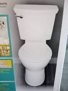 lot 30 image: Champion Tall Height 2-Piece High-Efficiency 1.28 GPF Single Flush Elongated Toilet in White Seat Included by American Standard
