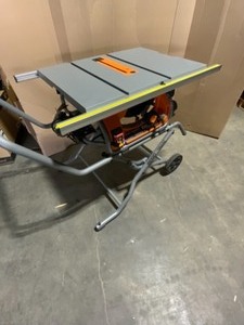 lot 1 image: RIGID 15 AMP 10 IN. HEAVY-DUTY PORTABLE TABLE SAW WITH STAND. SEE PICTURES