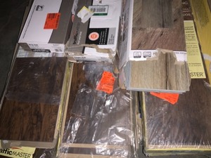 ASSORTED TRAFFIC MASTER & HOME DECORATORS COLLECTION LAMINATE & VINYL FLOORING. VARIOUS KINDS AND CONDITIONS. SEE PICTURES