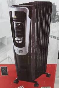 lot 21 image: NEW IN BOX  NEW AIR OIL HEATER