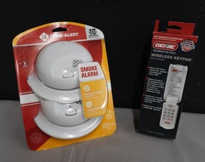 lot 23 image: NEW IN PACKAGE SMOKE ALARMS AND GENIE WIRELESS KEYPAD