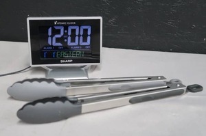 lot 25 image: ATOMIC CLOCK AND TONGS