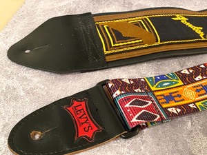 lot 124 image: Two Guitar Straps one by Fender