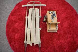Antique phone and sled