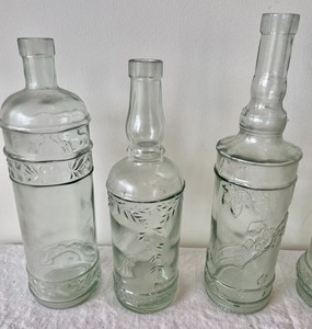 lot 129 image: 6 Decorative Clear Glass Bottles