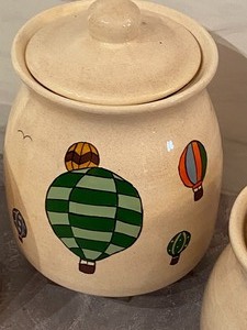 lot 83 image: Three Piece Canister set w One  Painted in Hot Air Balloon Design