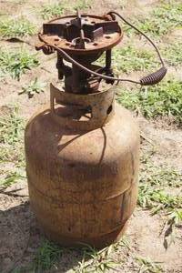 Vintage Cast Iron Burner with Propane Tank