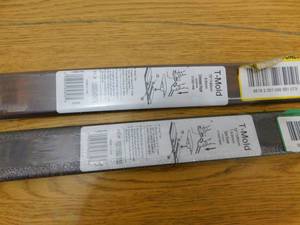 lot 49 image: (2) Dark Brown Hickory 716 in. Thick x 1-34 in. Wide x 72 in. Length Laminate T-Molding