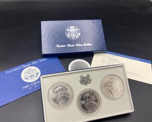 lot 44 image: Set of Three Olympic Silver Dollars
