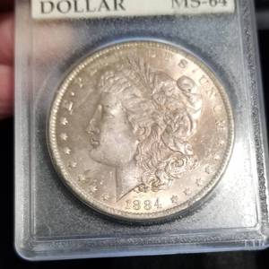 lot 18 image: 1884-O MORGAN SILVER DOLLAR MS64 OLD HOLDER