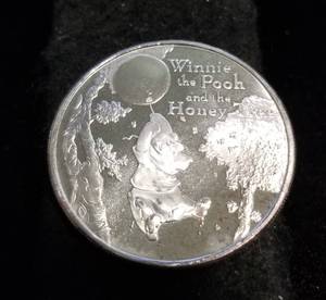 lot 56 image: 1 TROY OZ. .999 FINE SILVER DISNEY WINNIE THE POOH ROUND