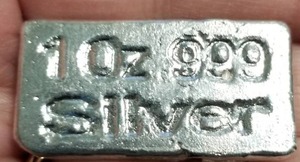 lot 62 image: 1 TROY OZ. .999 FINE SILVER BAR HAND POURED & STAMPED