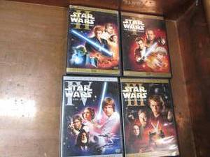 lot 26 image: Set of 4 Star Wars DVDs. Phantom Me...