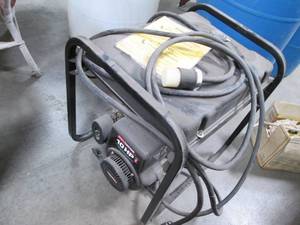 lot 61 image: Coleman Powermate Gas Generator. 10...