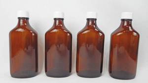 lot 101 image: Set of 4 Vintage 8 Ounce Graduated Amber Glass Ovals