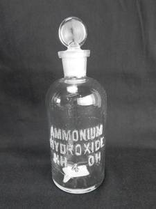 lot 169 image: Set of 2 Vintage T.C.W. Co. Ammonium Hydroxide Glass Bottles With Stoppers