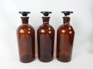 lot 172 image: Set of 3 Vintage T.C.W. Co. 500 ML Amber Glass Bottles With Stoppers