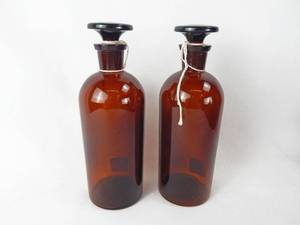 lot 173 image: Set of 2 Vintage T.C.W. Co. 500 ML Amber Glass Bottles With Stoppers