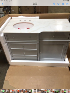 lot 7 image: Hampton Harbor 48 in. Vanity in Dove Grey with Natural Marble Vanity Top in White with White Sink by Home Decorators Collection Customer Returns See Pictures