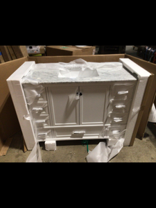 lot 33 image: Merryfield 49 in. W x 22 in. D Bath Vanity in White with Marble Vanity Top in Carrara White with White Basin by Home Decorators Collection Customer Returns See Pictures