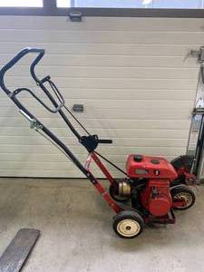 lot 3 image: Toro 2 HP Lawn Edger with Mitsubishi Engine