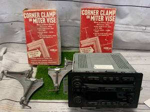 lot 93 image: GMC Pickup Factory Stereo & 2 Corner Clamps