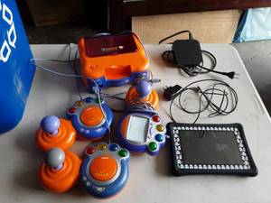 lot 34 image: NUBI Tablet With Charger, Apple TV Box, V-Tech TV Game