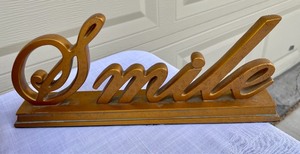 lot 139 image: Pine Cone Basket and 2 Smile Signs