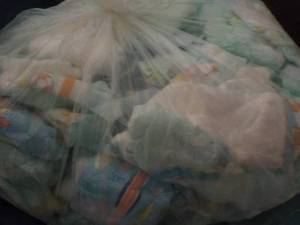 Bag of 100 or so Diapers newborn - ...