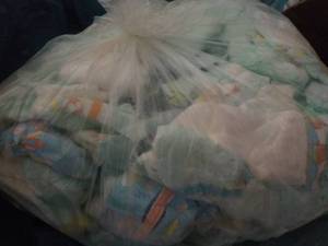 Bag of 100 or so Diapers newborn - ...