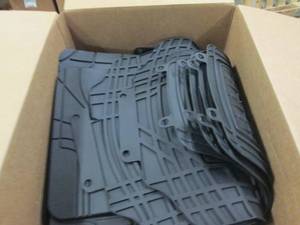 box of automotive rubber floor mats...