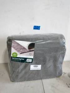 lot 32 image: Uni-Luxe 10 ft. x 13 ft. Anti-Slip Rug Pad