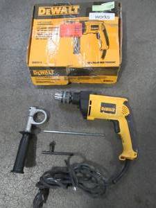 lot 73 image: DEWALT 12 in. Variable Speed Reversible Hammer Drill, DW511 - Slightly Used.