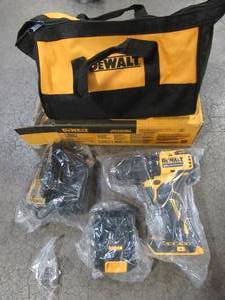 lot 74 image: Dewalt ATOMIC 20-Volt MAX Cordless Brushless Compact 12 in. Hammer Drill, (2) 20-Volt 1.3Ah Batteries, Charger & Bag, DCD709C2 - Like New.