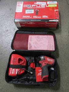 lot 95 image: Milwaukee M12 FUEL SURGE 12-Volt Lithium-Ion Brushless Cordless 14 in. Hex Impact Driver Compact Kit wOne 2.0Ah Battery, Charger and Bag, 2551-22 - Used.