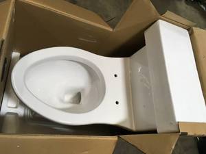 lot 3 image: Erica 12 in. Rough-In 1-piece 1.28 GPF Single Flush Elongated Toilet in White and Seat Included by Glacier Bay Customer Returns See Pictures