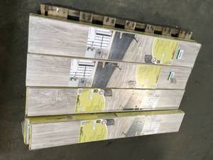 lot 4 image: 9 Boxes Lakeshore Pecan Stone 7mm Thick x 7-23 in. Wide x 50-58 in. Length Laminate Flooring (24.17 sq. ft.  case) by TrafficMaster Customer Returns See Pictures
