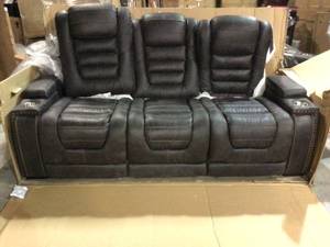 lot 64 image: Ashley Cave Warrior Power Reclining Leather Match Sofa (9430115) slight damage see pictures
