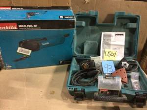 lot 93 image: 3 Amp Corded Variable Speed Oscillating Multi-Tool Kit With Blade, Sanding Pad, Sandpaper, Adopter, Hard Case USED by Makita Customer Return See Pictures