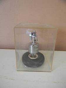 lot 86 image: VINTAGE 1940S DUNLOP TYRES TROPHY TABLE LIGHTER BY ANGLIA - IN A CASE - VERY COOL PIECE - SEE PICTURES